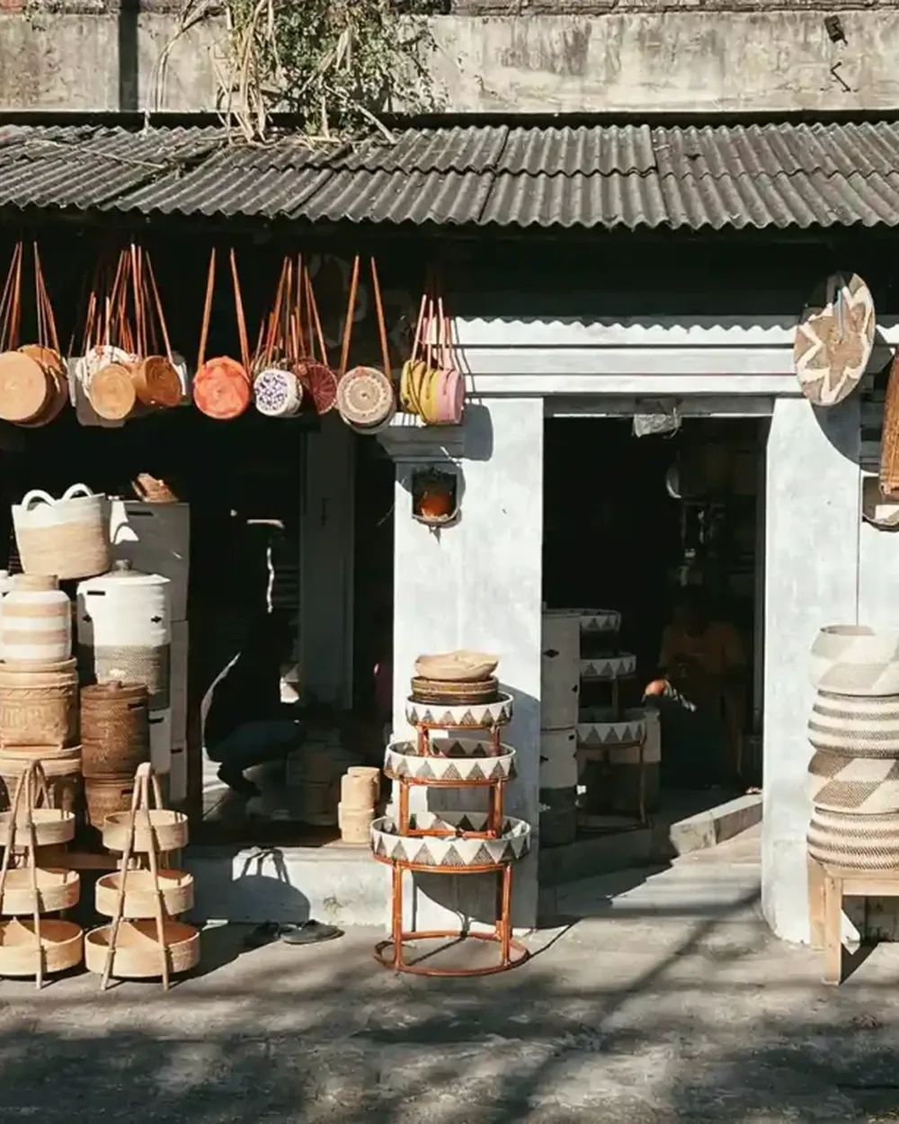 A Balinese shopfront stacked with handwoven natural-fibre baskets