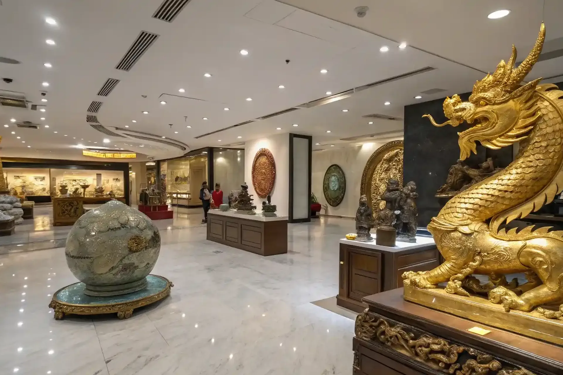 The studio showroom with finished pieces displayed on lit plinths