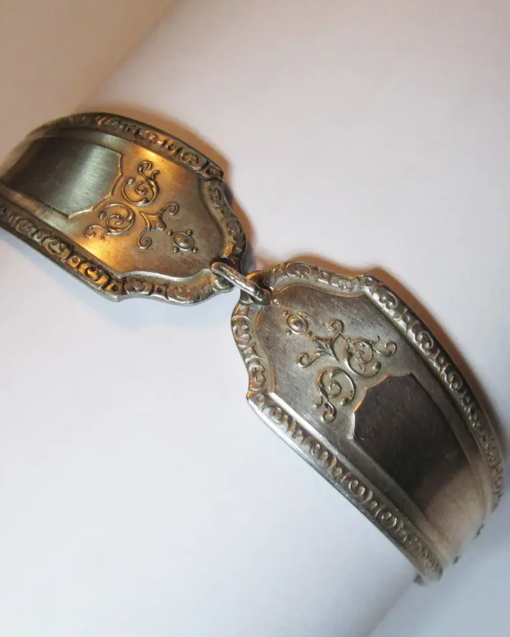 A hand-engraved Balinese silver cuff photographed close up