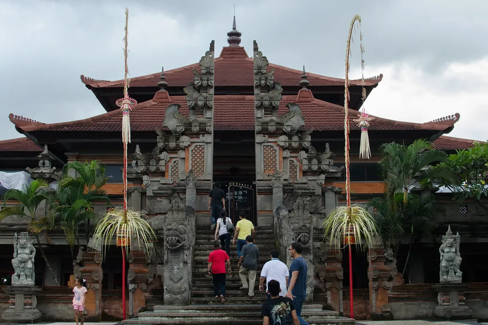 A Balinese temple gate under an overcast sky