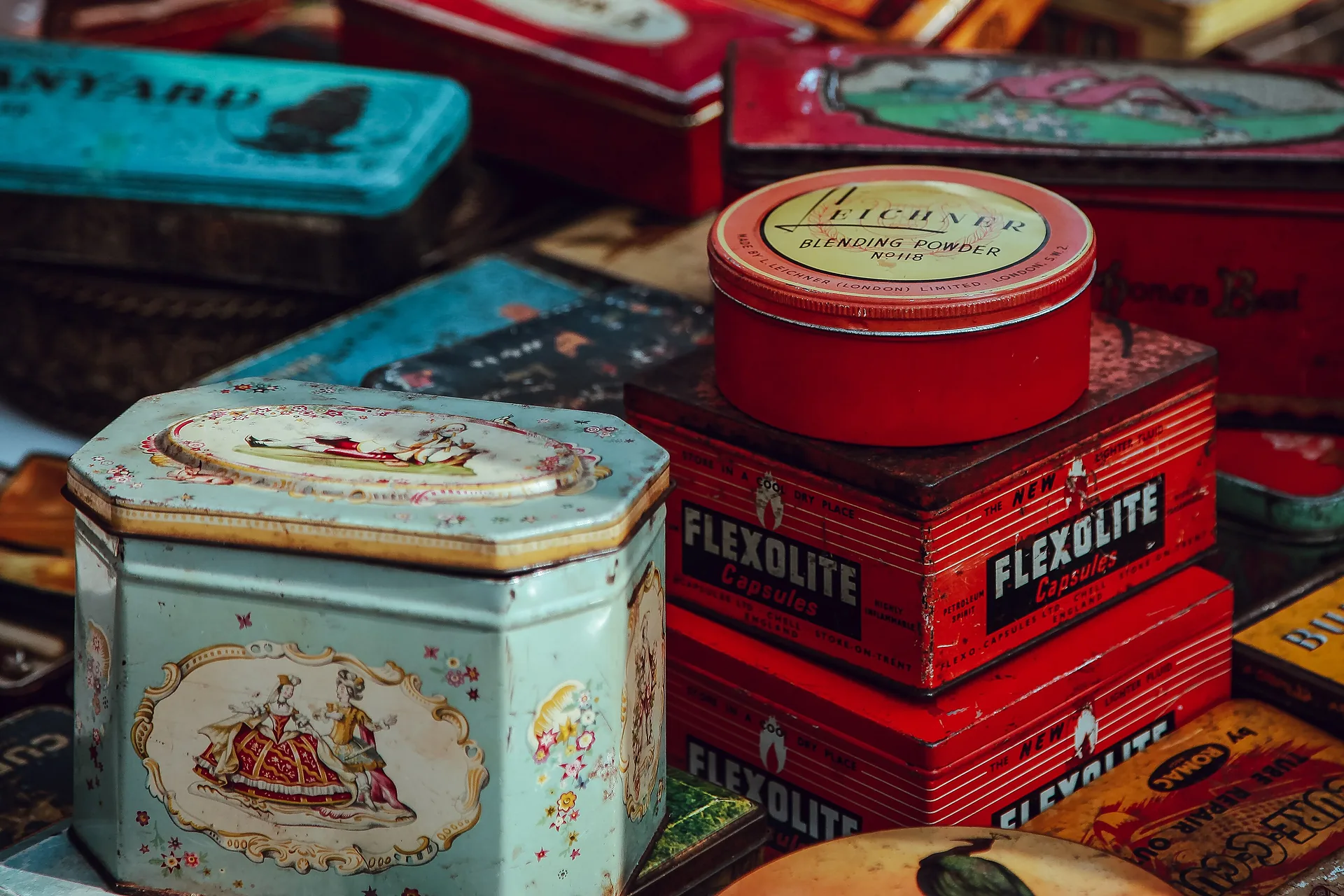 Gift tins and boxes arranged on a market table