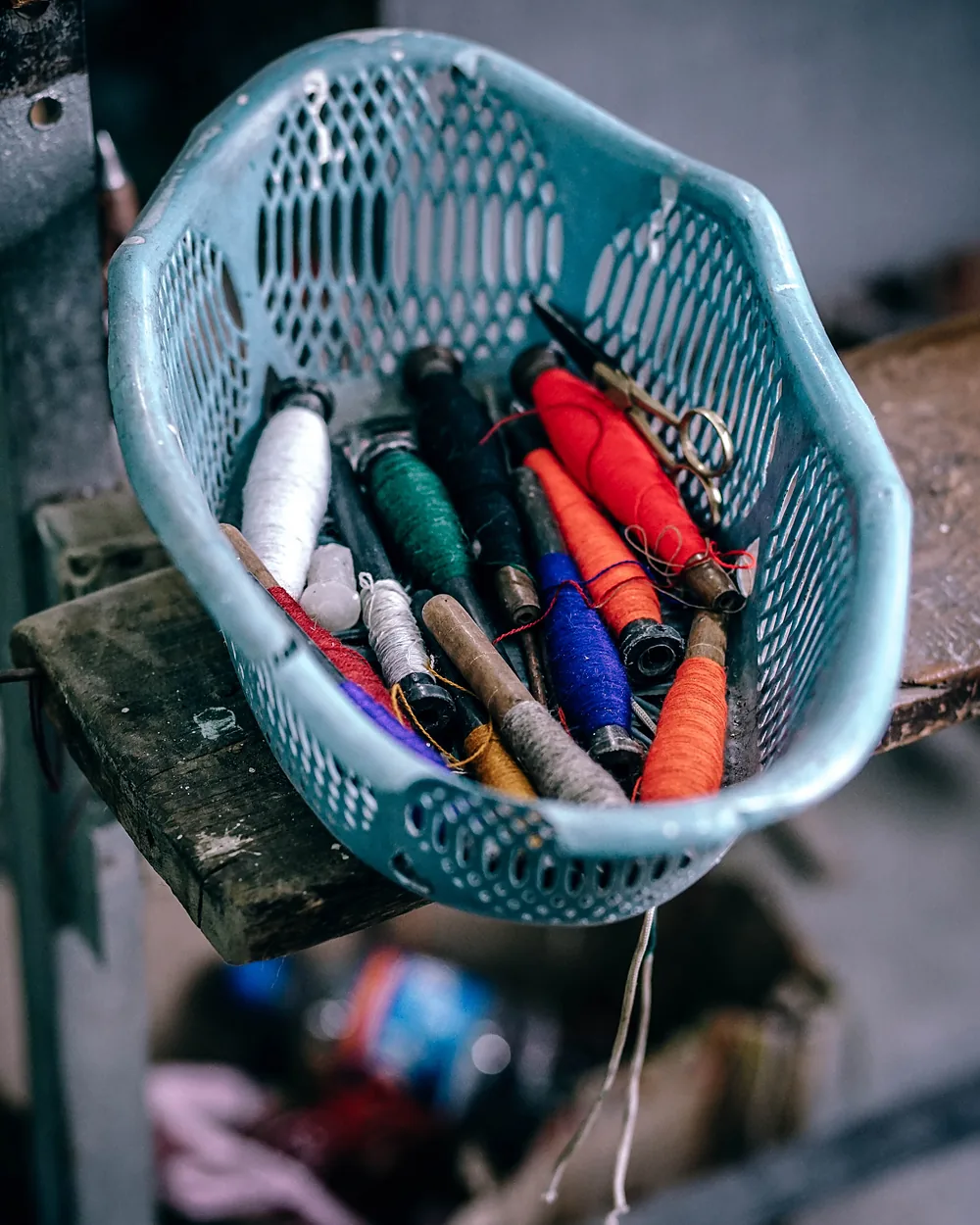 A basket of coloured threads and materials prepared for a group session