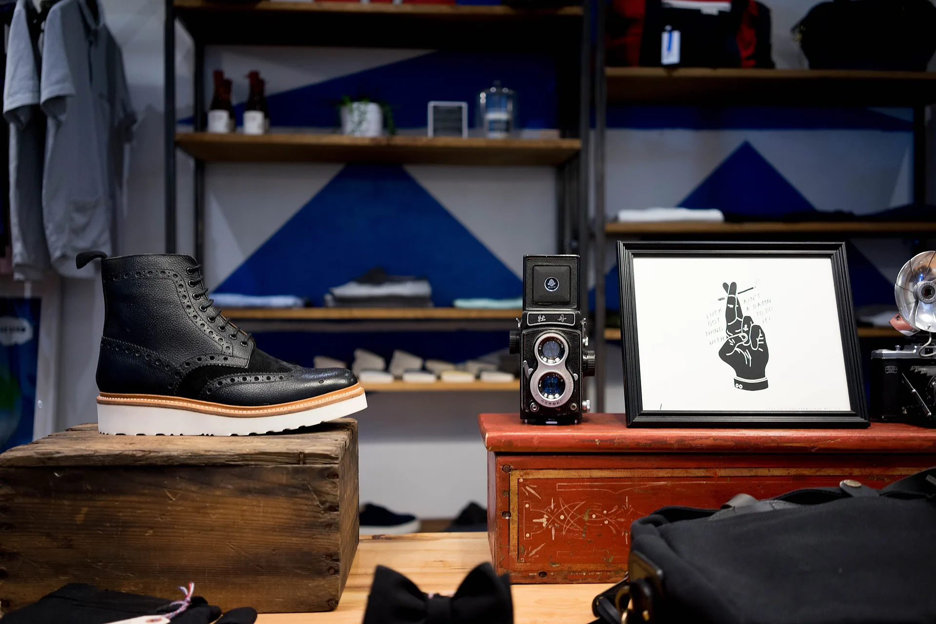 A leather goods shop interior with pieces displayed on open shelves