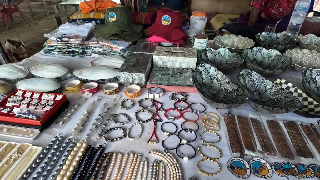 Handcrafted pearl accessories displayed at a market stall