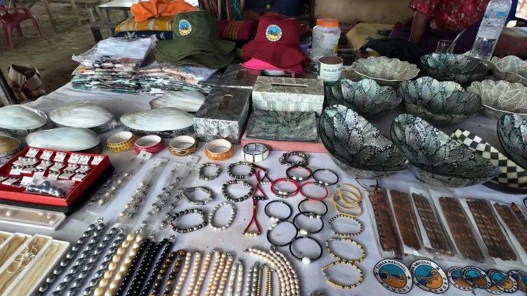 Handcrafted pearl accessories displayed at a market stall